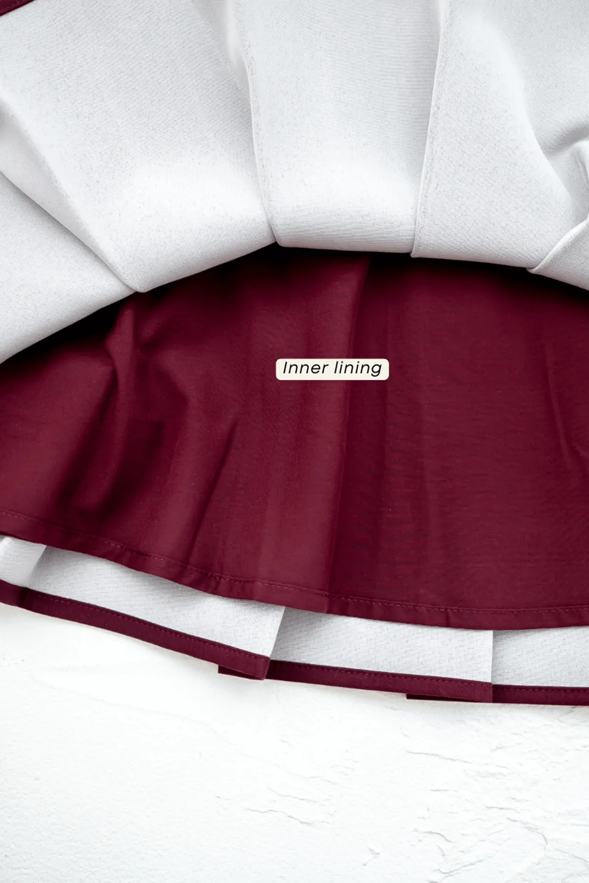 CAMU PLEATED SKIRT IN WINE