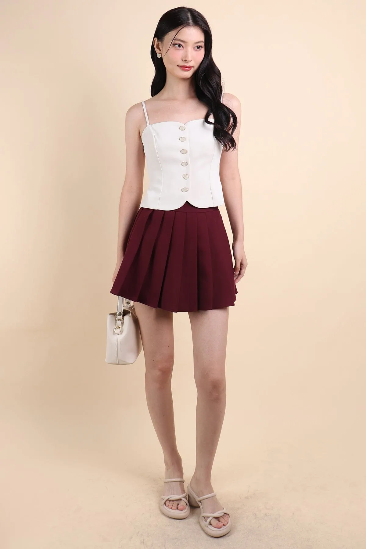 CAMU PLEATED SKIRT IN WINE