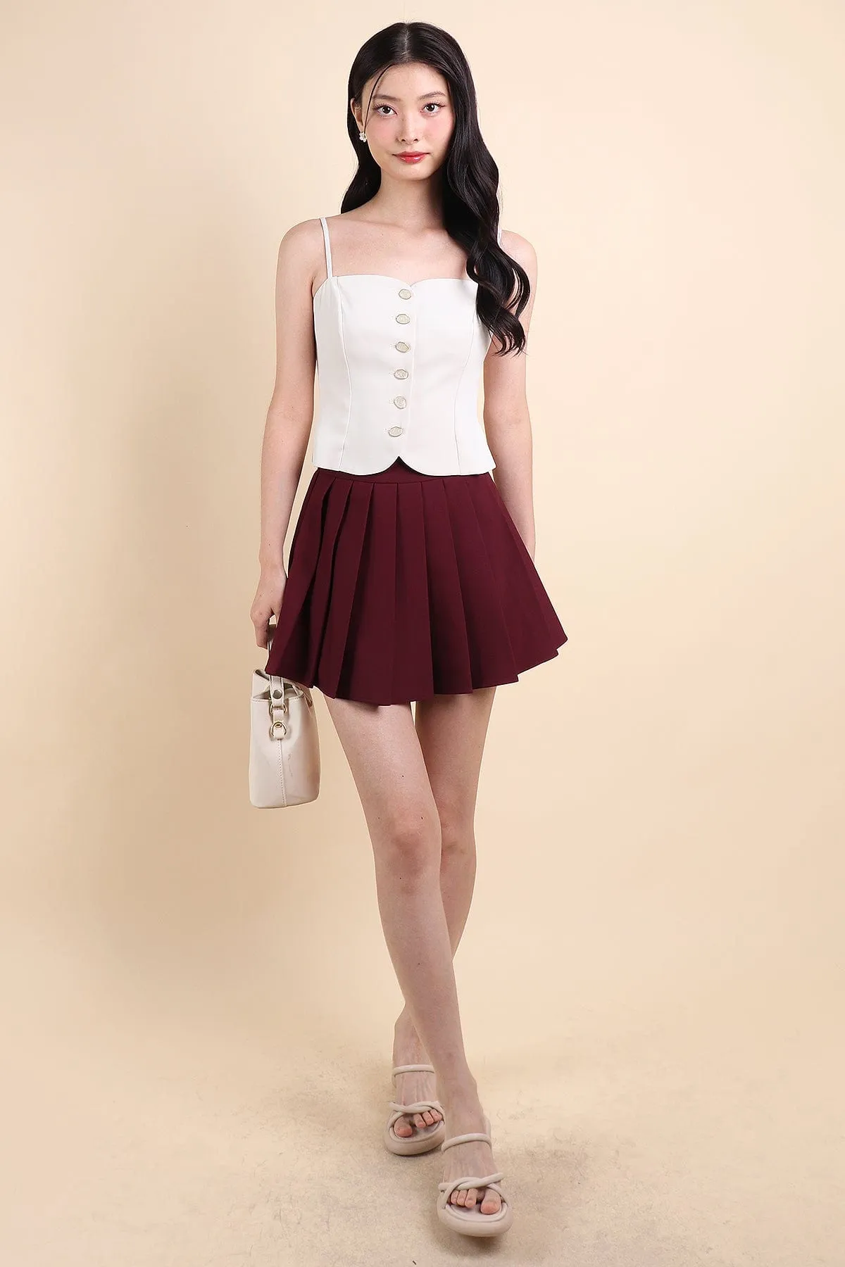 CAMU PLEATED SKIRT IN WINE