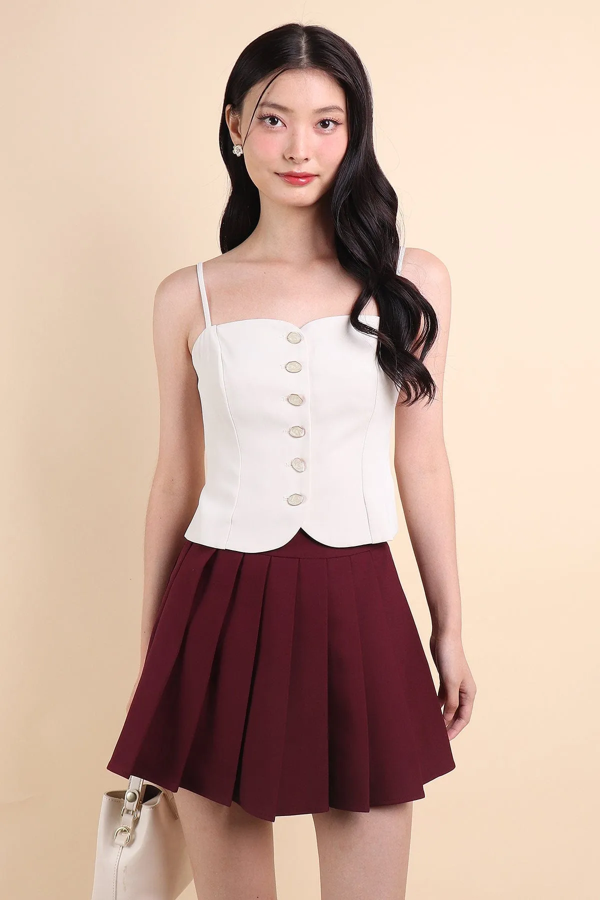 CAMU PLEATED SKIRT IN WINE